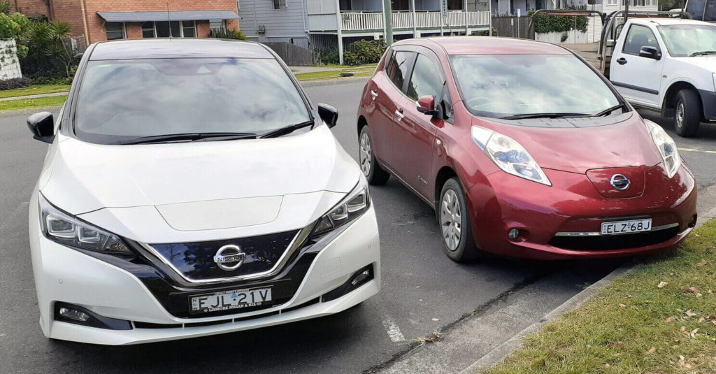 Nissan LEAF electric vehicles in white and red